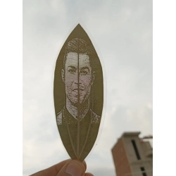 Custom Engraved Leaf Art – Football Icon Portrait on Natural Lea