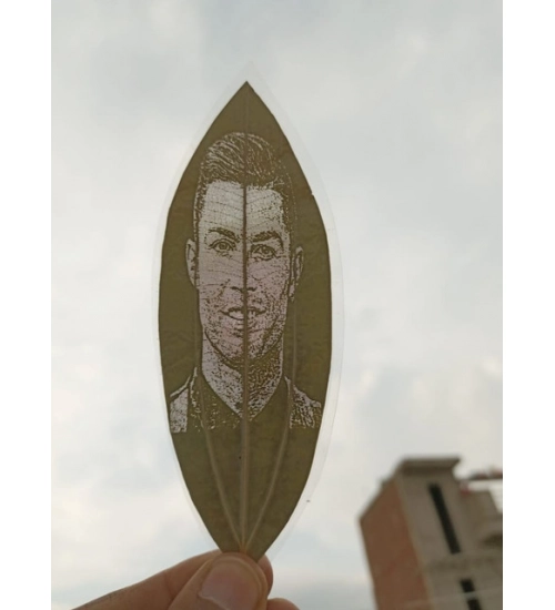 Custom Engraved Leaf Art – Football Icon Portrait on Natural Lea